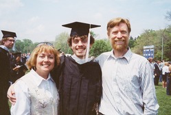 Kevin in his graduation robe with Kathy and Scott